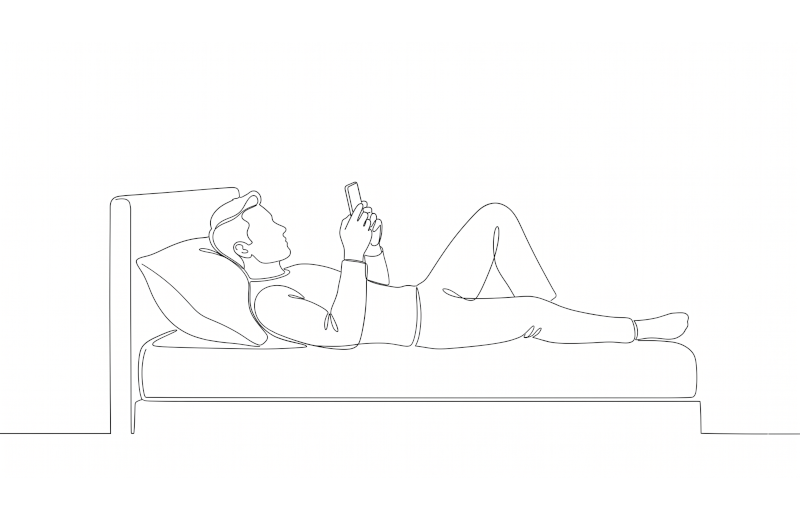 Person in bed on phone